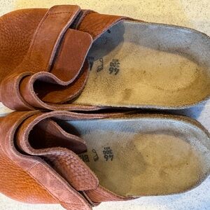 Men’s Birkenstock clogs.